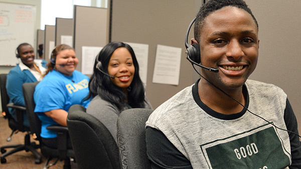 student communication assistants wearing headsets